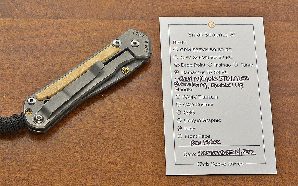 Small Sebenza 31 Drop Point Boomerang Damascus Box Elder Inlay