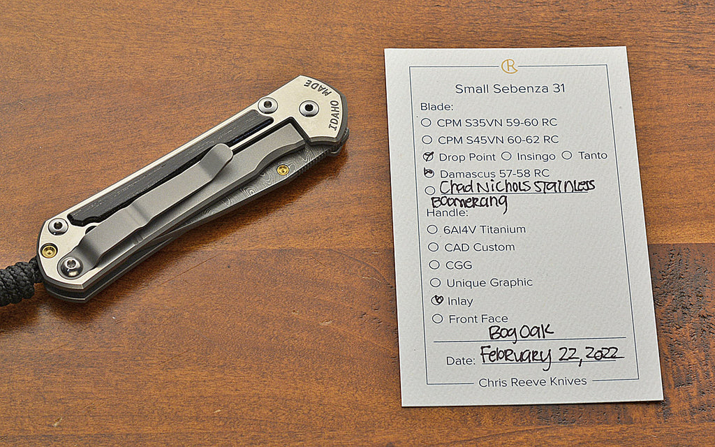 Pre-Owned Small Sebenza 31 Drop Point Boomerang Damascus Bog Oak Inlay